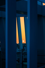 Metal structures of the suspension bridge against the background of the dying sunset