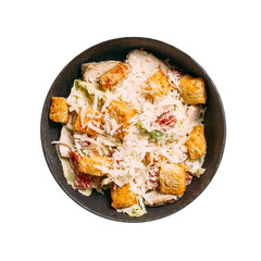 Isolated black bowl of caesar with croutons and chicken