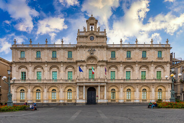 Fototapeta na wymiar Historical building of the oldest University in Sicily, it's academic nickname Siculorum Gymnasium is to be seen over the entrance. Catania, Sicily, Italy.