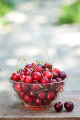 Ripe red cherries in a cup. Summer background 