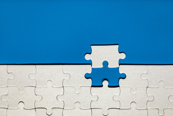 White jigsaw puzzle pieces. Fill in pieces of the jigsaw puzzle. Complete the jigsaw puzzle with...