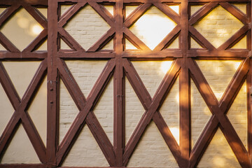 Background of a building wall with wood paneling. Geometric shapes. Modern architecture and design.