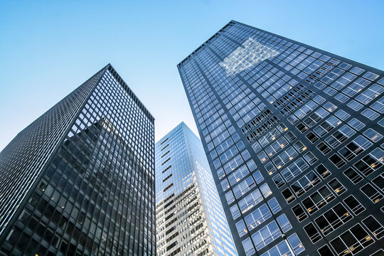 Modern glass skycraper with sunlight