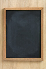 Blackboard on a wood background