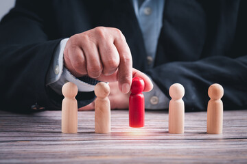 leadership business concept, leader teamwork power and confidence, hand holding leader to success business create idea, professional hand holding wooden figures selection leader  business conceptual.