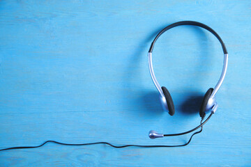 Customer service headset on the blue background.