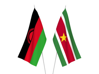 National fabric flags of Malawi and Republic of Suriname isolated on white background. 3d rendering illustration.