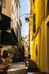 Typical old street with restaurants in the middle of Corsican Ajaccio city. France 2021