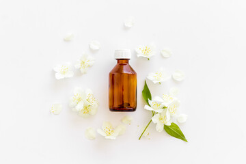 Jasmine flowers essential massage oil. Perfume oil with jasmine