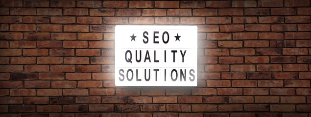 Fototapeta na wymiar SEO quality solutions leterboard text