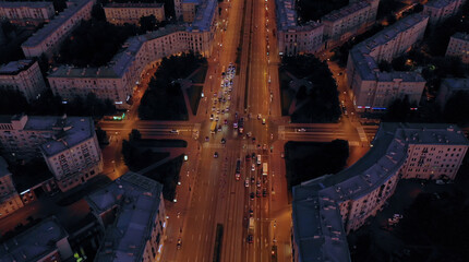 Aerial view of the fascinating cityscape of a long highway with burning lights