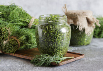 Glass jar with saly fresh dill for long-term storage.