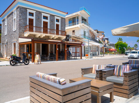 Methana, Peloponnese, Greece. June 2021: Cafe with tourists and vacationers in the resort town of Methana in the Peloponnese in Greece on a summer day