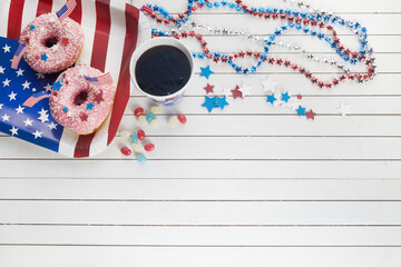 American independence day, celebration, patriotism and holidays concept. Sweet donut with candies in disposable tableware at 4th july party.