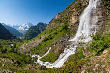 Fototapeta na wymiar The Ecrins National Park most famous waterfall: Le Voile de La Mariée. Valgaudemar Valley in Summer, Hautes-Alpes, French Alps, France