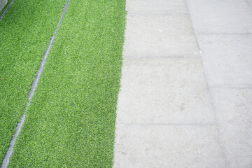 Green grass on cement pathway exterior decoration