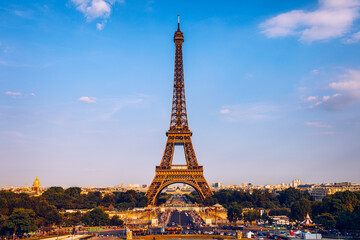 Eiffel tower in summer, Paris, France. Scenic panorama of the Eiffel tower under the blue sky. View of the Eiffel Tower in Paris, France in a beautiful summer day. Paris, France.