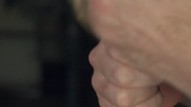 Man wrapping twine around fingers, Kenilworth, Coventry, UK