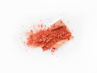 On a white background, there are broken blush for the face or eye shadow. Cosmetic swatches. Loose eye shadow and blush. Decorative cosmetics on a white background. Eye and face makeup product.