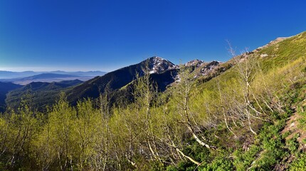 Rocky Mountains Lowe Peak views of Oquirrh range toward Utah Lake, Timpanogos, Wasatch Front by Rio Tinto Bingham Copper Mine, in spring. Utah. United States. USA.