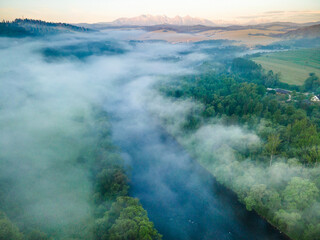Fog and Mist at Sunrise Over Dunajec River in Pieniny, Poland. Aerial Drone View