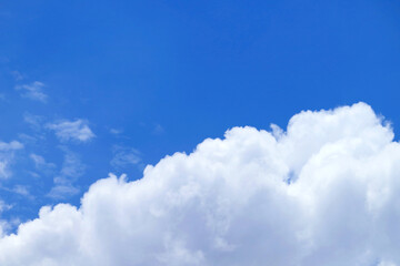 Naklejka na ściany i meble Pure white fluffy cumulus clouds on vivid blue sky 