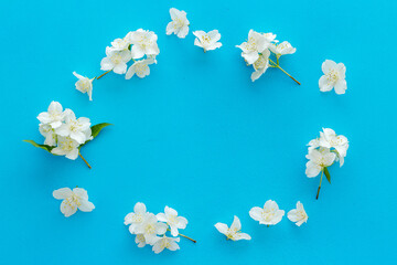 Top view of blossom jasmine flowers. Floral pattern flat lay