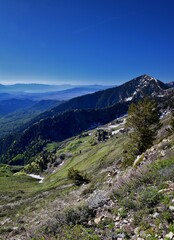 Fototapeta premium Rocky Mountains Lowe Peak views of Oquirrh range toward Utah Lake, Timpanogos, Wasatch Front by Rio Tinto Bingham Copper Mine, in spring. Utah. United States. USA.