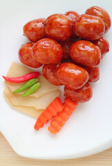 Plate of Northeastern Thai Sausages Called Sai krok Isan, One of a Popular Street Food in Thailand  - obrazy, fototapety, plakaty