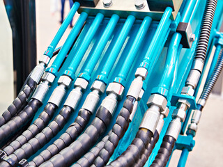 Hydraulic hoses on industrial machine