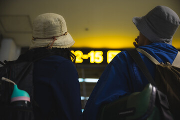 traveler couple person travel at aerodrome with baggage, journey vacation trip with man and woman, flight transportation arrival waiting in airport terminal