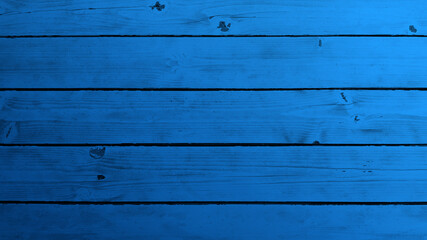 Fototapeta premium Top view of blue background wooden planks board texture.