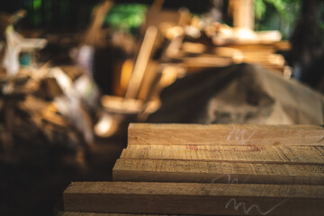 Background image of furniture woodworking workshop, carpenters industrial wooden material work table with different craft tools and wood cutting stand, vintage filter image.