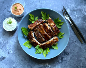 Grilled barbecue pork rib with american sauce and garlic sauce. 