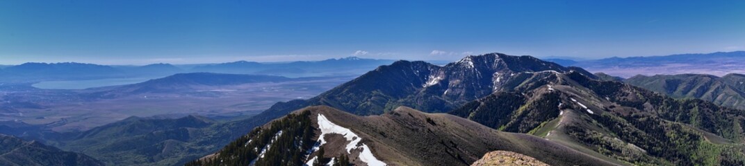 Fototapeta premium Rocky Mountains Lowe Peak views of Oquirrh range toward Utah Lake, Timpanogos, Wasatch Front by Rio Tinto Bingham Copper Mine, in spring. Utah. United States. USA.