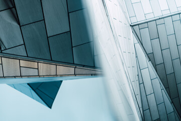 underside panoramic and perspective view to steel blue glass high rise building skyscrapers, business concept of successful industrial architecture