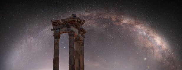 Columns of the ancient city of Pergamon, Milky way galaxy in the background - Bergama, Turkey