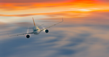 Fototapeta na wymiar Airplane in the sky at sunset