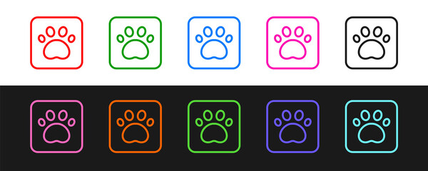 Set line Paw print icon isolated on black and white background. Dog or cat paw print. Animal track. Vector © Vadim