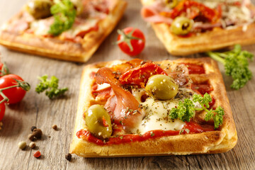 waffle pizza with ham, tomato and mozzarella