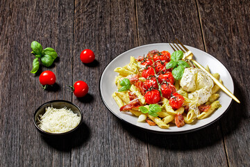 Pasta with bacon tomatoes and mozzarella, top view