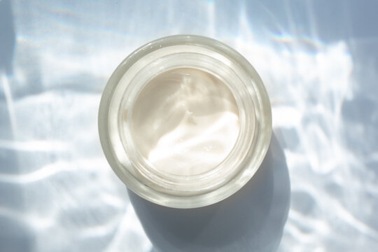 Flat Lay With A Jar Of Moisturiser On A Background With Underwater Effect.