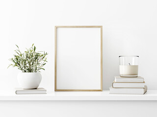Vertical wooden frame mockup with green olive twigs in vase and candle on pile of books on white wall background. A4, A3, A size, 3d rendering, illustration