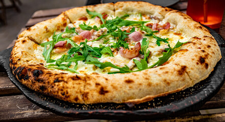 Pizza with Mozzarella cheese, mushrooms, ham, tomato sauce, pepper, Spices and Fresh arugula. Italian pizza on wooden table background