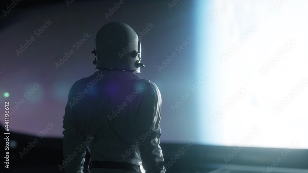 Wall mural alone astronaut looking at the huge illuminator of an unknown spaceship interior. 3d rendering