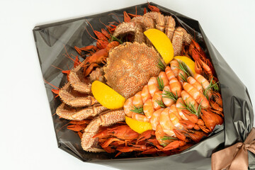 close-up Creative edible Food bouquet ion white background. Handmade bouquet for a man of crab,...