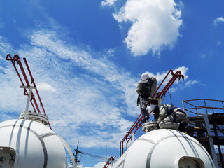 worker inspection at flange pipe of visual check record pipeline tank farm gas
