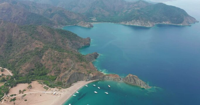 Aerial drone of Cirali beach and Olympos Olimpos mountain in a beautiful day light. Kemer, Antalya, Mediterranean region, Turkey, Lycia. Perfect sea view, nice for eyes of traveler.