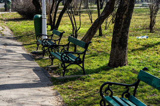 Closeup Shot Of Empty Benches In The Park In Bucharest, Romania