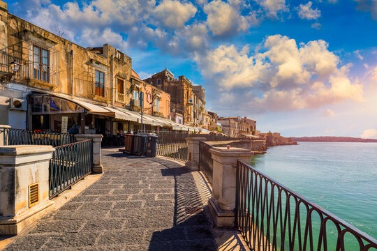 Siracusa, Ortigia Island, Sicily, Italy. Isola di Ortigia, coast of Ortigia island at city of Syracuse, Sicily, Italy. Coastline town Syracuse, Sicily and old Ortigia island.
